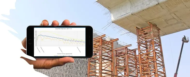 Viewing live HardTrack concrete temperature data on a phone at a bridge construction site